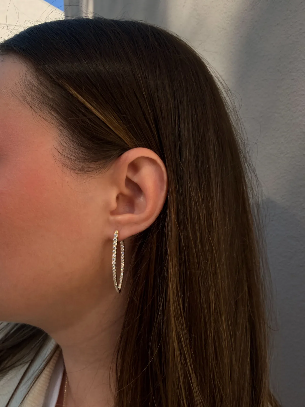 18k yellow gold teardrop diamond hoop worn on the ear